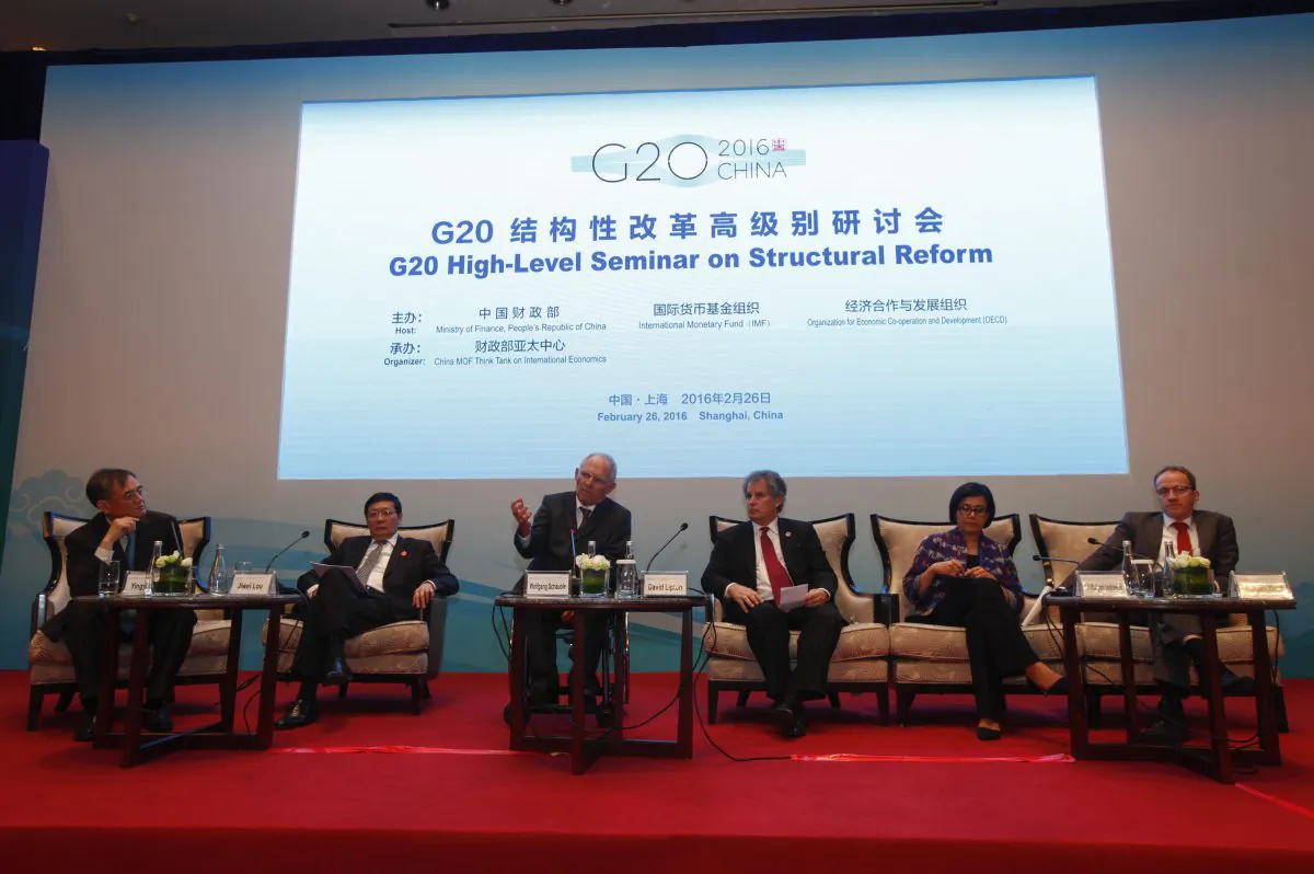 (L-R) Moderator Yingyi Qian, Chinese Finance Minister Lou Jiwei, German Finance Minister Wolfgang Schaeuble, IMF First Deputy Director David Lipton, World Bank Managing Director Sri Mulyani Indrawati, and Breugel Director Guntram Wolff compose a panel during a session of the G20 High-Level Seminar on Structural Reform, ahead of the G20 Finance Ministers and Central Bank Governors Meeting at the Pudong Shangri-la Hotel in Shanghai, China, on Feb. 26, 2016. (Rolex Dela Pena/AP)