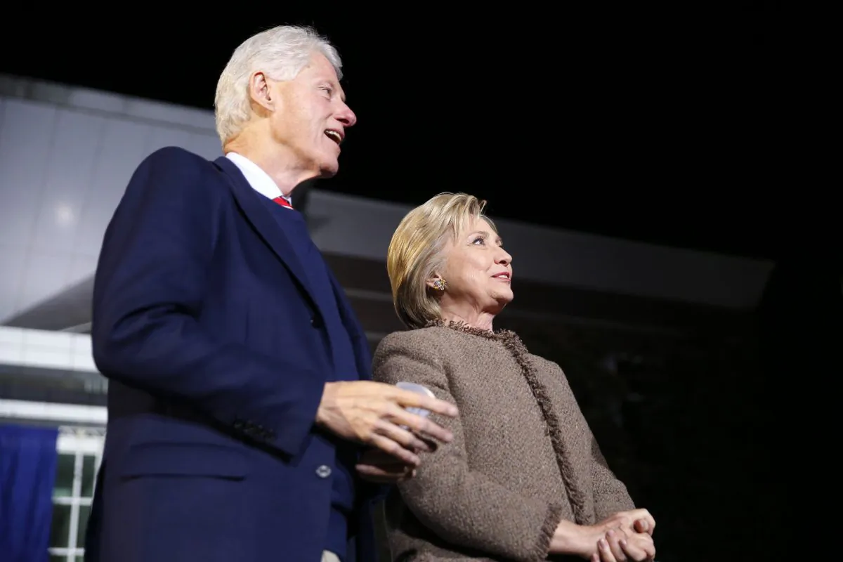 Democratic presidential candidate Hillary Clinton and her husband, former President Bill Clinton, arrive onstage to speak at a "Get Out The Vote Rally" in Columbia, S.C., on Feb. 26, 2016. (AP Photo/Gerald Herbert)