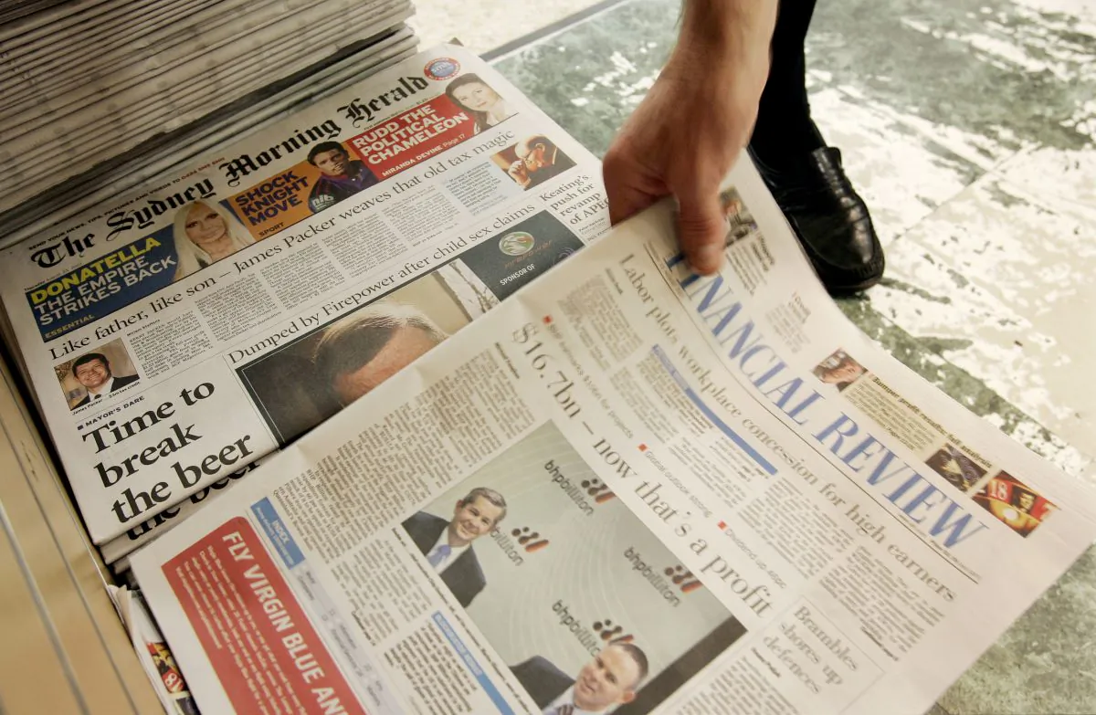 An Australian Financial Review, next to another Farifax paper, The Sydney Morning Herald, is taken from a newsstand in Sydney on Aug. 23, 2007. (AP Photo/Rick Rycroft)