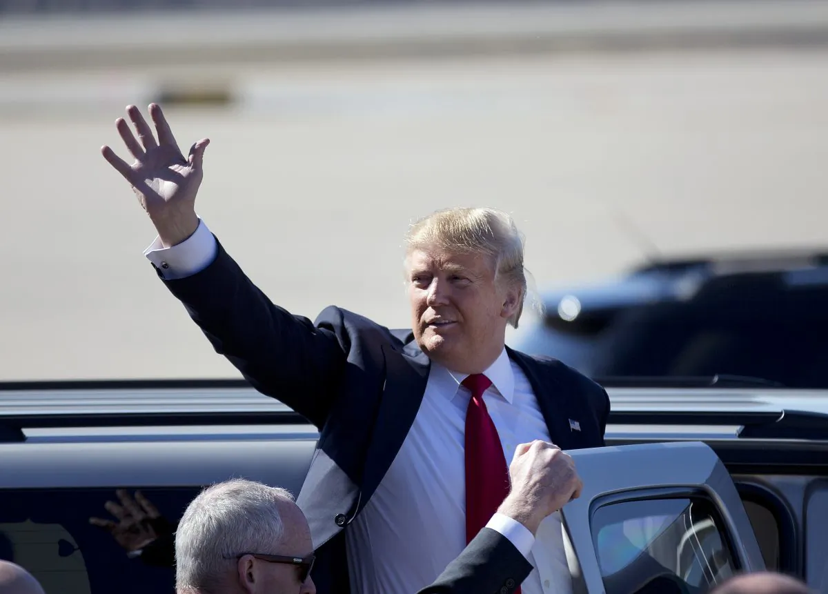 Republican presidential candidate Donald Trump waves as he leaves a rally in Bentonville, Ark., on Feb. 27, 2016. (AP Photo/John Bazemore)