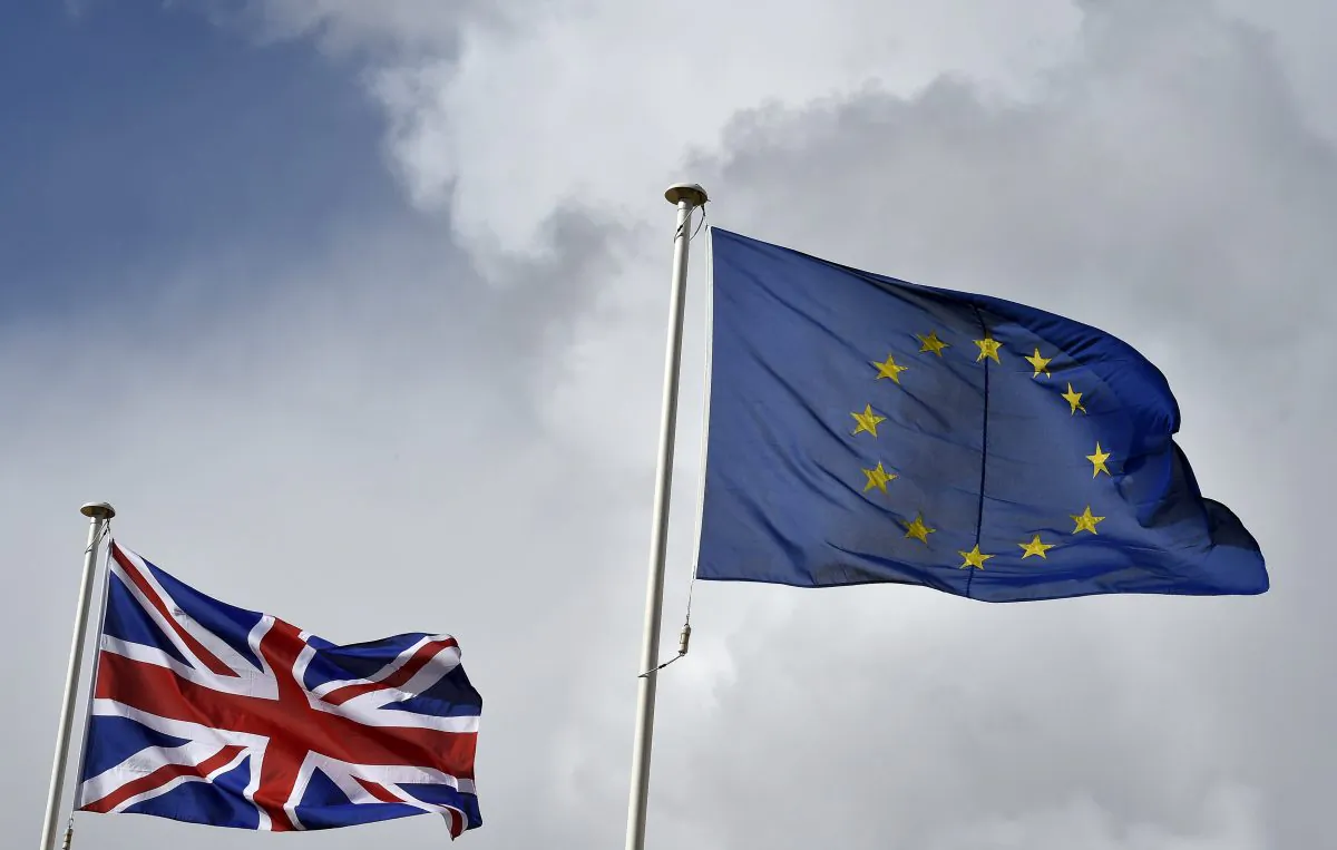 Great Britain's Union Jack flag flutters next to the EU flag at the opening ceremony of the Commonwealth Heads of Government Meeting (CHOGM) at the Mediterranean Conference Centre near Valletta, Malta, on Nov. 27, 2015. (Toby Melville/Getty Images)