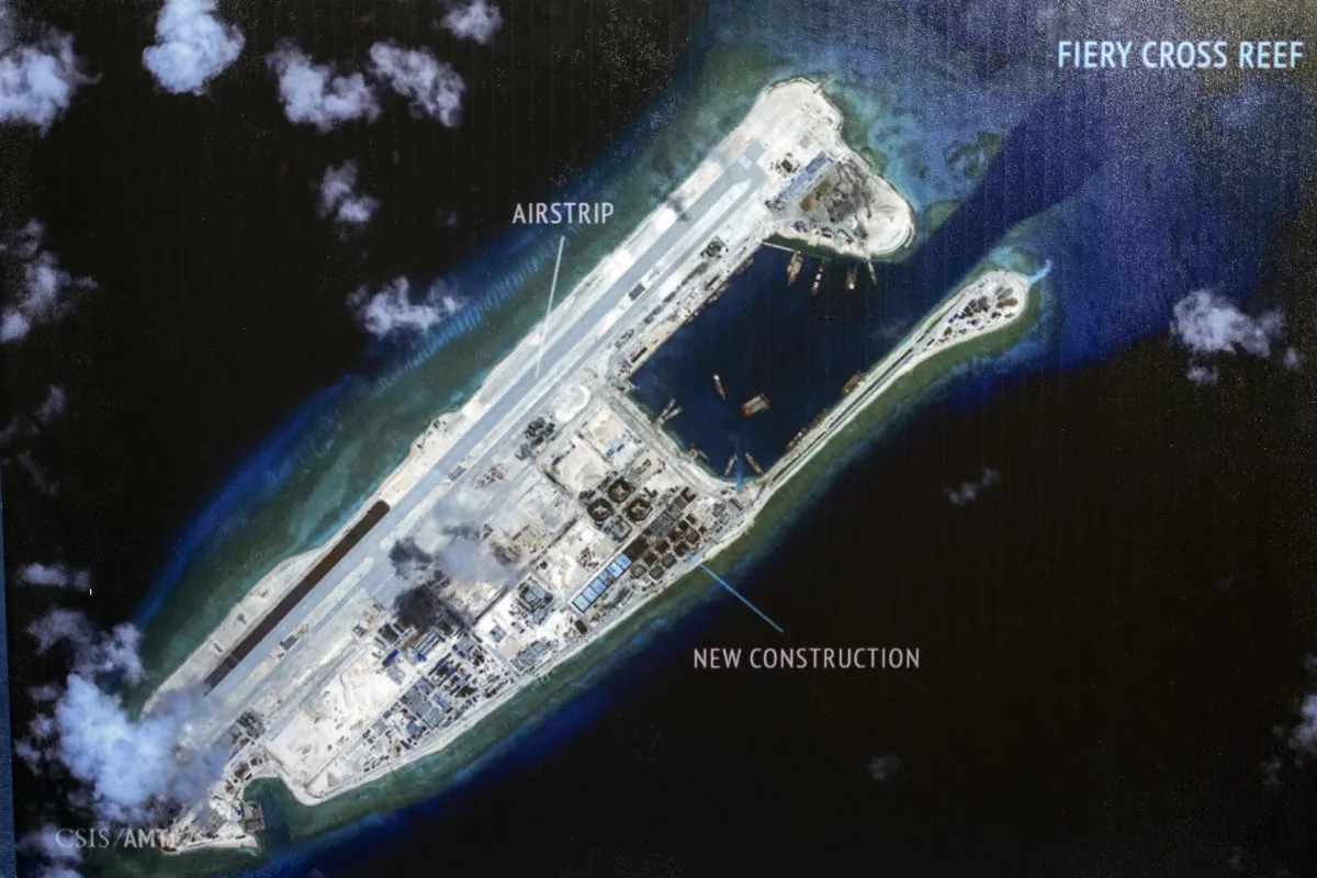 An island that China is building on the Fiery Cross Reef in the South China Sea. The Chinese regime is now deploying "anti-access" weapons in the region. (Cliff Owen/AP)