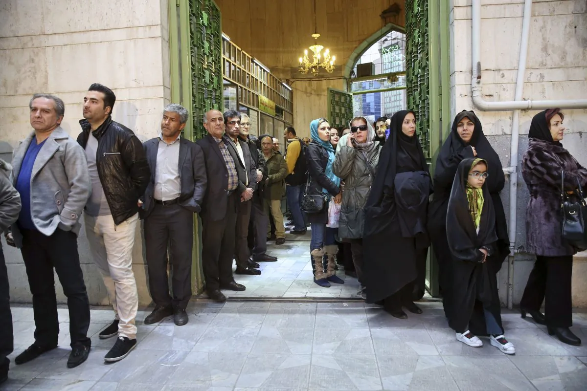Iranians queue for voting in the parliamentary and Experts Assembly elections in a polling station in Tehran, Iran, on Feb. 26, 2016. (AP Photo/Vahid Salemi)