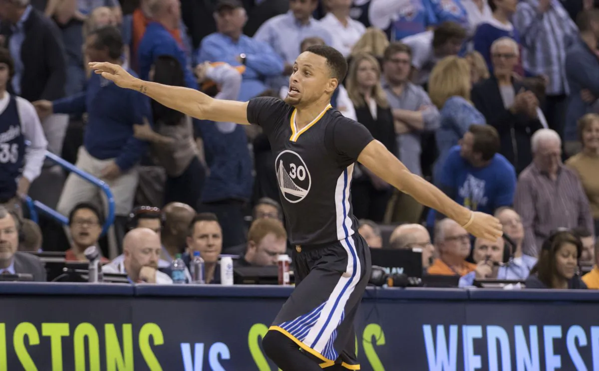 Stephen Curry hit 12 threes in Golden State's overtime win over Oklahoma City. (J Pat Carter/Getty Images)