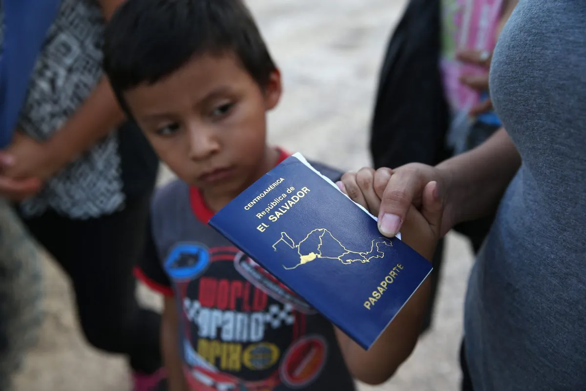 Families of Central American immigrants turn themselves in to U.S. Border Patrol agents after crossing the Rio Grande River from Mexico to McAllen, Texas, on Sept. 8, 2014. Although the numbers of such immigrant families and unaccompanied minors have decreased from a springtime high, many continue to cross in the border illegally into the United States. (John Moore/Getty Images)