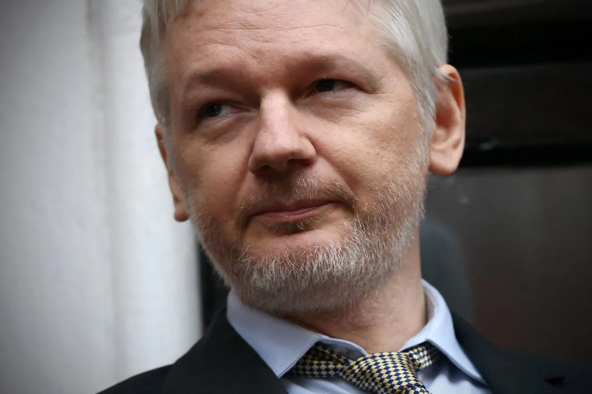 Wikileaks founder Julian Assange speaks from the balcony of the Ecuadorian embassy where he continues to seek asylum following an extradition request from Sweden in 2012, on February 5, 2016 in London, England. (Carl Court/Getty Images)