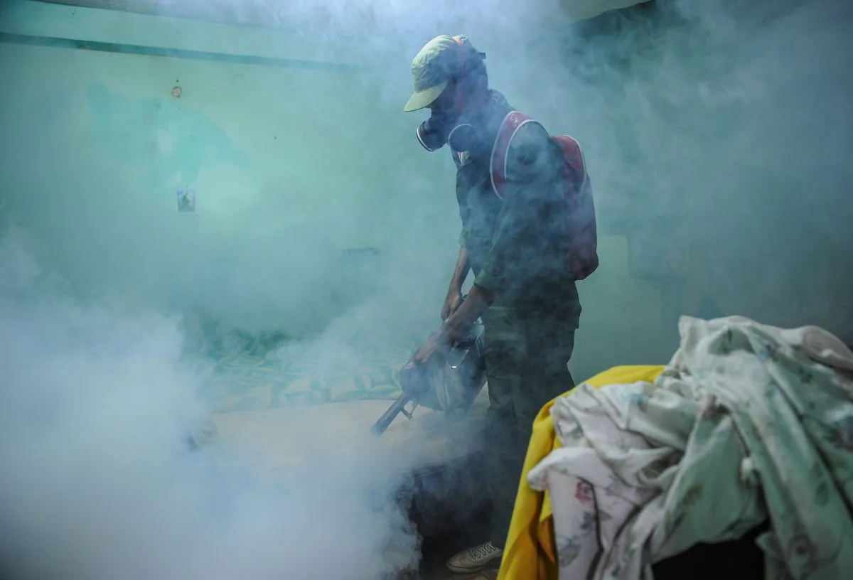 A member of the Cuban army fumigates against the Aedes aegypti mosquito to prevent the spread of zika, chikungunya and dengue, in Havana, on February 23, 2016. (YAMIL LAGE/AFP/Getty Images)