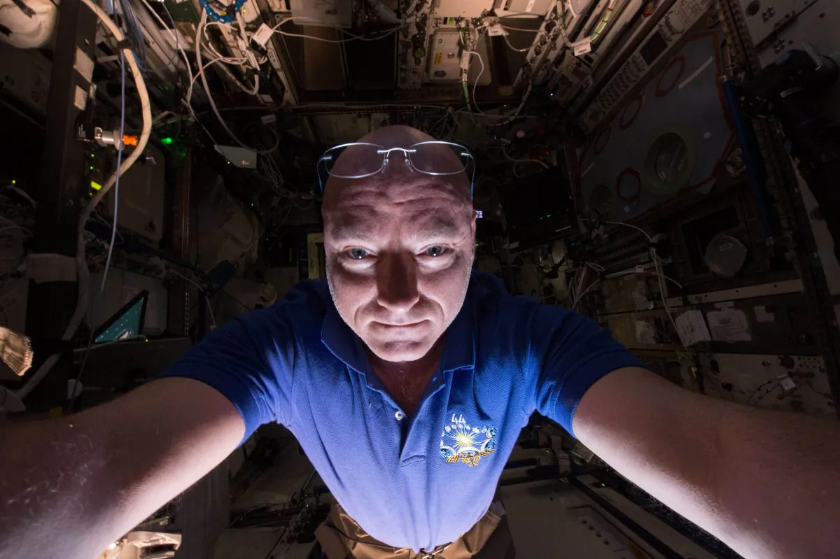 In this June 14, 2015 photo made available by NASA, astronaut Scott Kelly makes a photo of himself as he prepares a scientific experiment on the International Space Station. (Scott Kelly/NASA via AP)