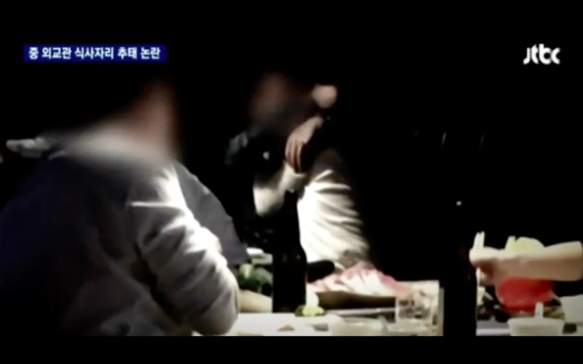 Censored screenshot from video taken at the scene of the drunken dinner. (via JTBC)