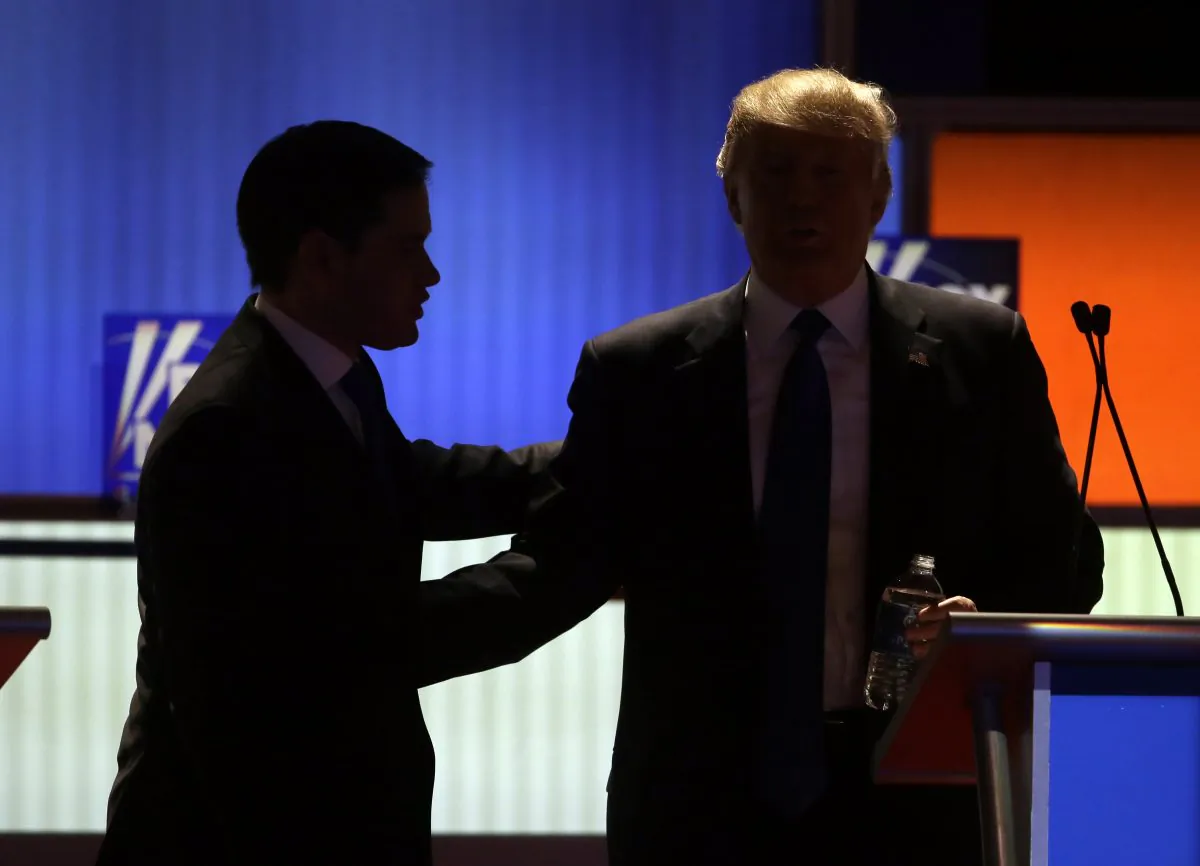 Republican presidential candidates Sen. Marco Rubio and businessman Donald Trump during a commercial break at a Republican presidential primary debate at Fox Theatre in Detroit on March 3, 2016. (AP Photo/Carlos Osorio)