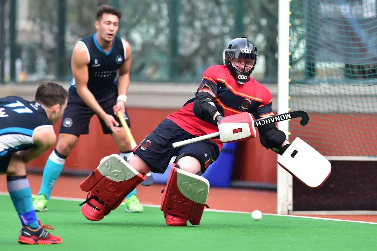Gus Allan of HKFC-A scores against HKCC-A in the Premier division match at HKFC on Sunday Feb 28. HKFC went on to win a close contest 5-3 to retain their 2nd place in the standings behind Khalsa-A. (Bill Cox/Epoch Times)