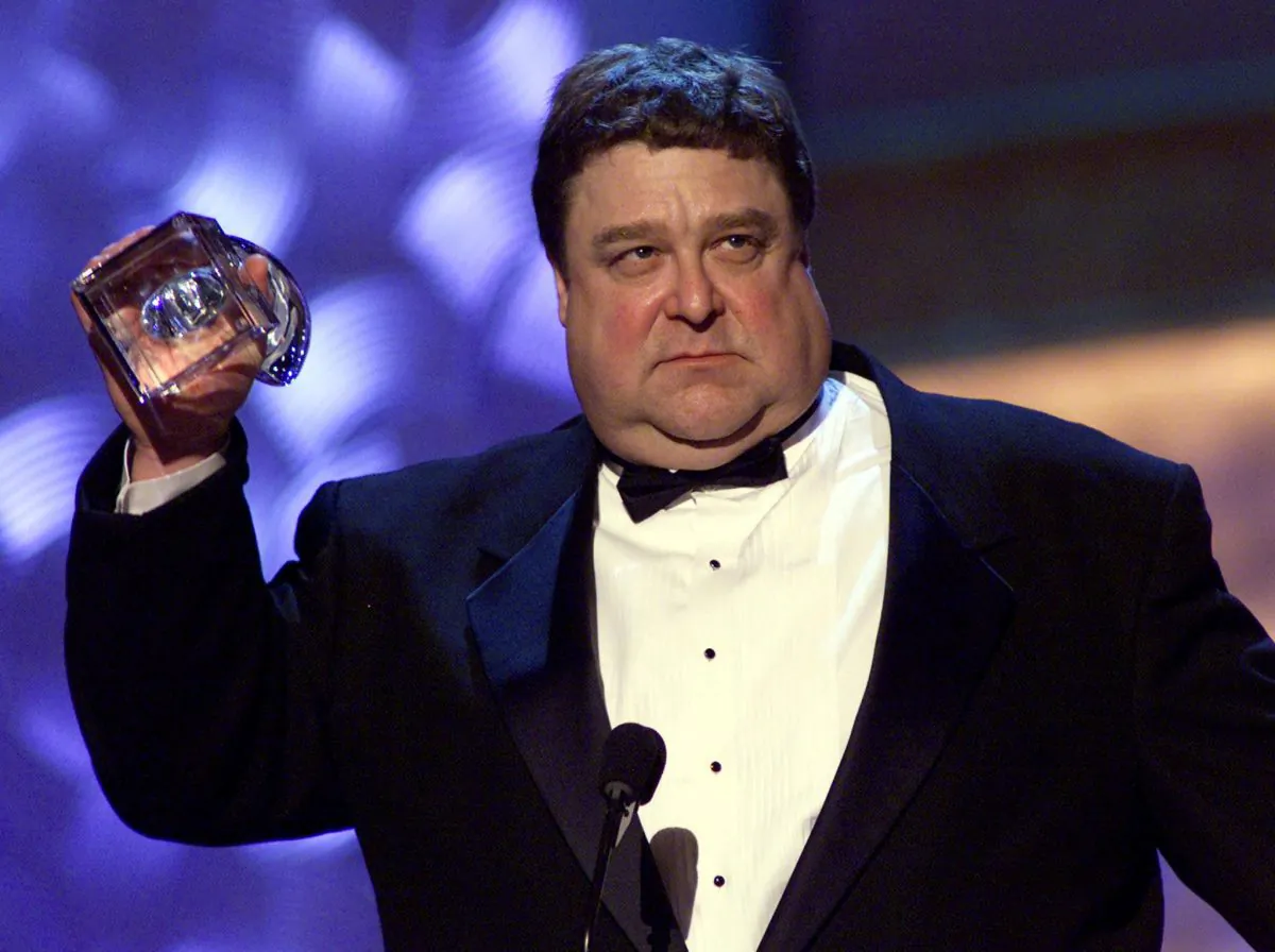  Actor John Goodman of the television show "Normal, Ohio" accepts his People's Choice Award for "Favorite Male Performer in a New Television Series" during the 27th Annual People's Choice Awards 07 January 2001 in Pasadena CA. (LUCY NICHOLSON/AFP/Getty Images)