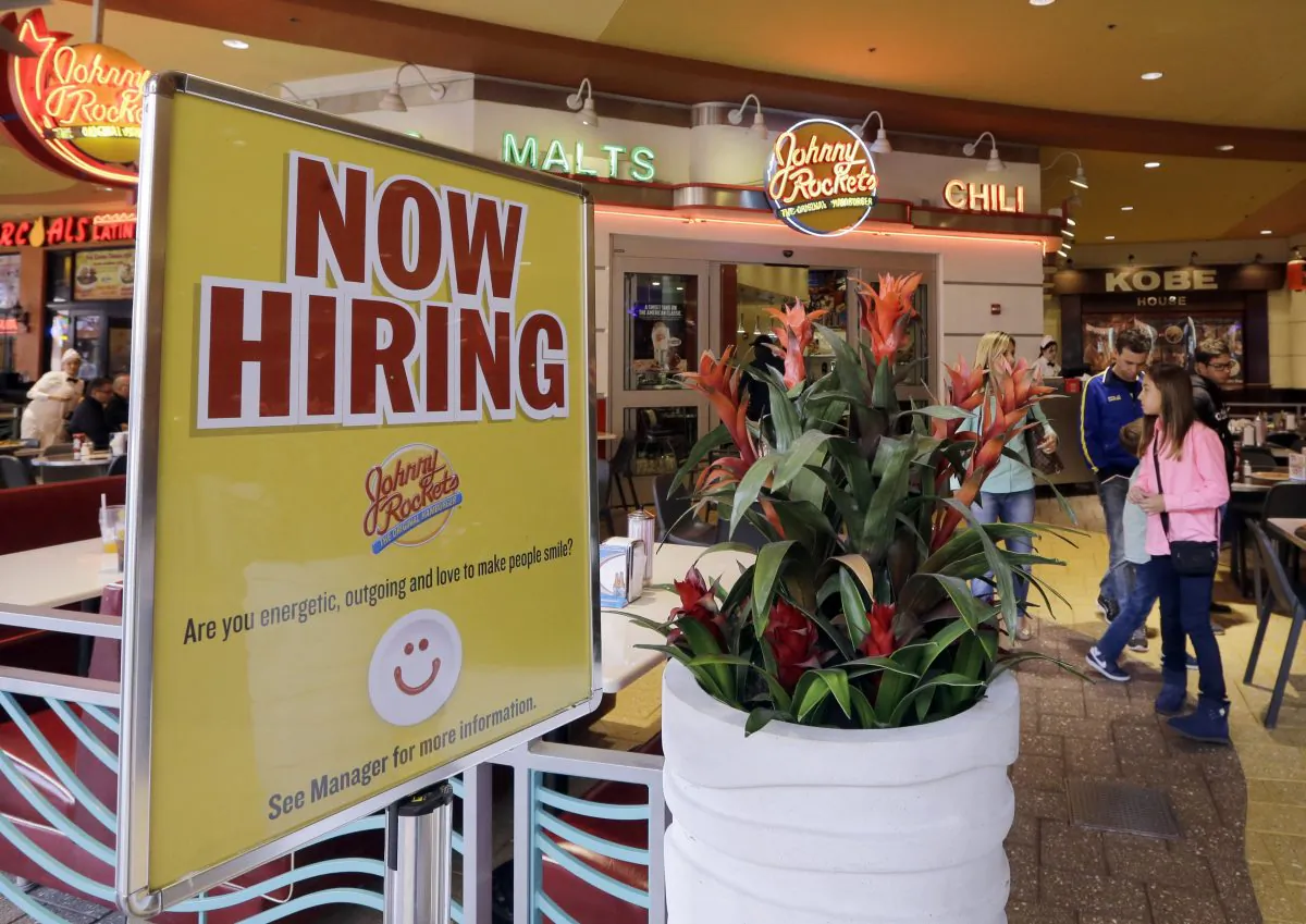 A restaurant posts a sign indicating they are hiring in Miami on Feb. 9, 2016. (AP Photo/Alan Diaz)