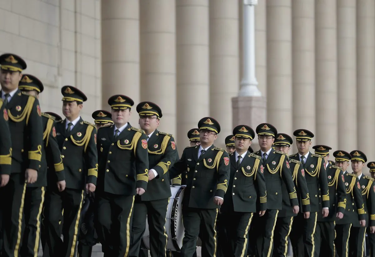 Members of the Chinese military band arrive at the Great Hall of the People for the opening session of the annual National People's Congress in Beijing on March 5, 2016. (AP Photo/Andy Wong)