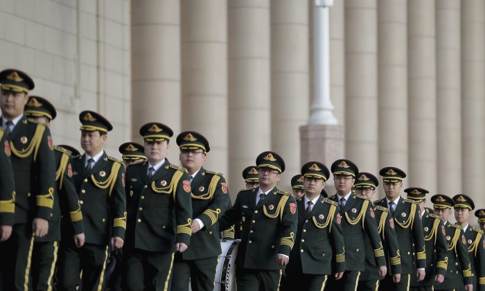 Members of the Chinese military band arrive at the Great Hall of the People for the opening session of the annual National People's Congress in Beijing on March 5, 2016. (AP Photo/Andy Wong)