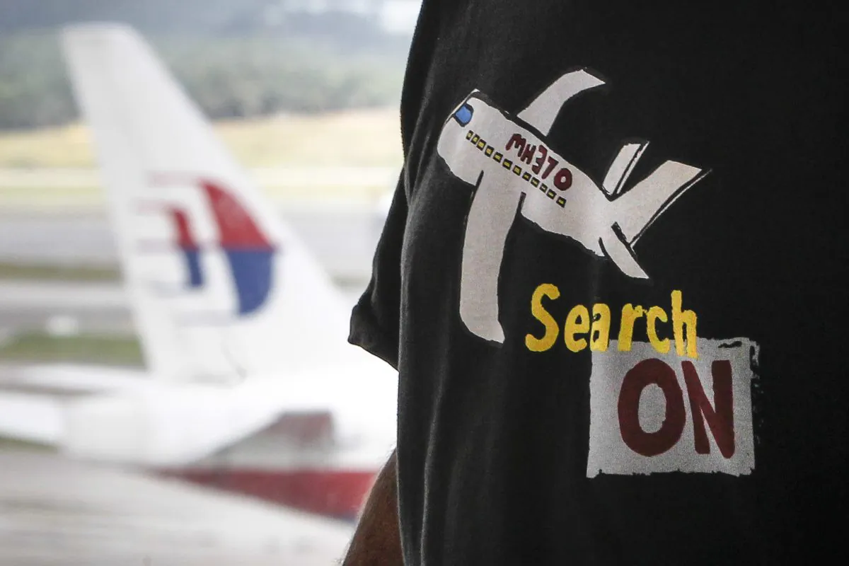 American adventurer Blaine Gibson speaks to The Associated Press during an interview at the Kuala Lumpur International Airport in Sepang, Malaysia, 
on March 5, 2016. Gibson said Saturday that it would be a "very lucky discovery" if the piece of aircraft he found on a sandbank off the coast of Mozambique is confirmed to be from the Malaysia Airlines jet that vanished two years ago. (AP Photo/Joshua Paul)