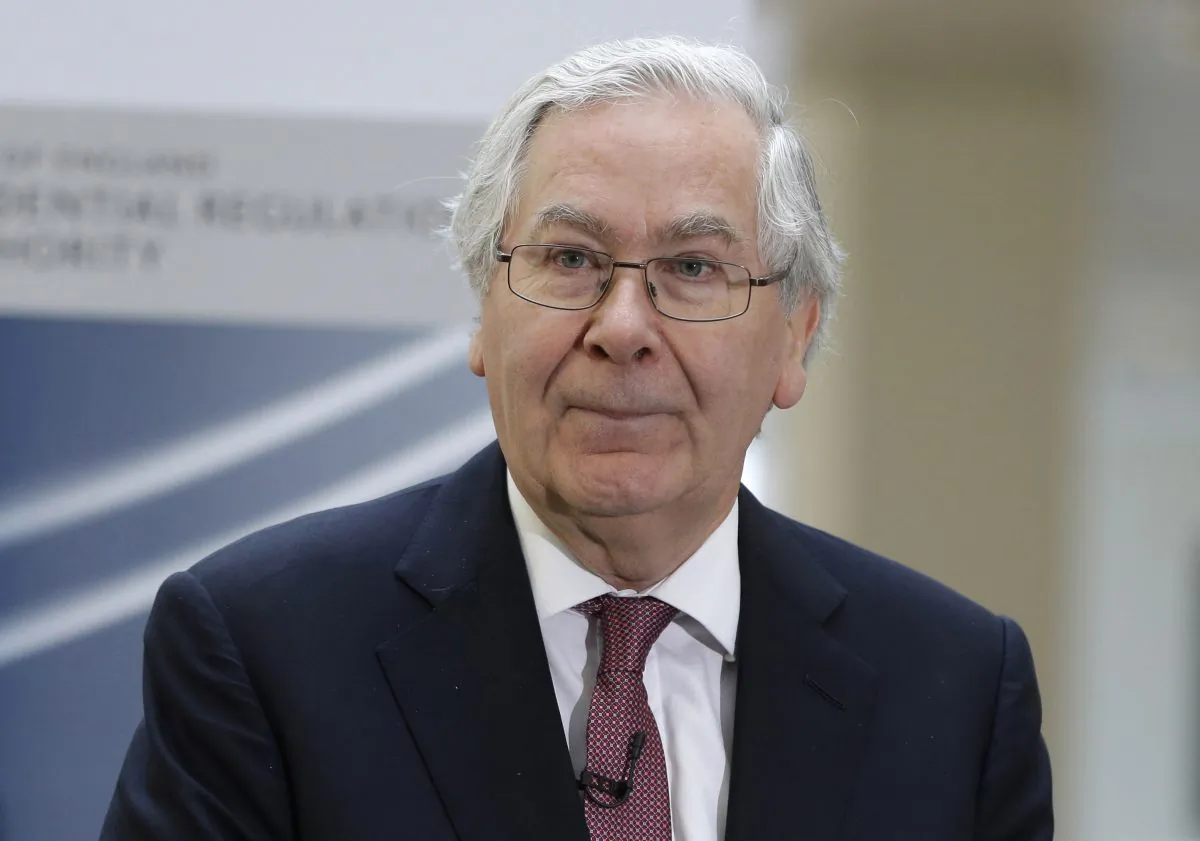Mervyn King, then governor of the Bank of England, talks to employees of the Prudential Regulation Authority, during the opening in central London, on April 2, 2013. (Lefteris Pitarakis/AP Photo)