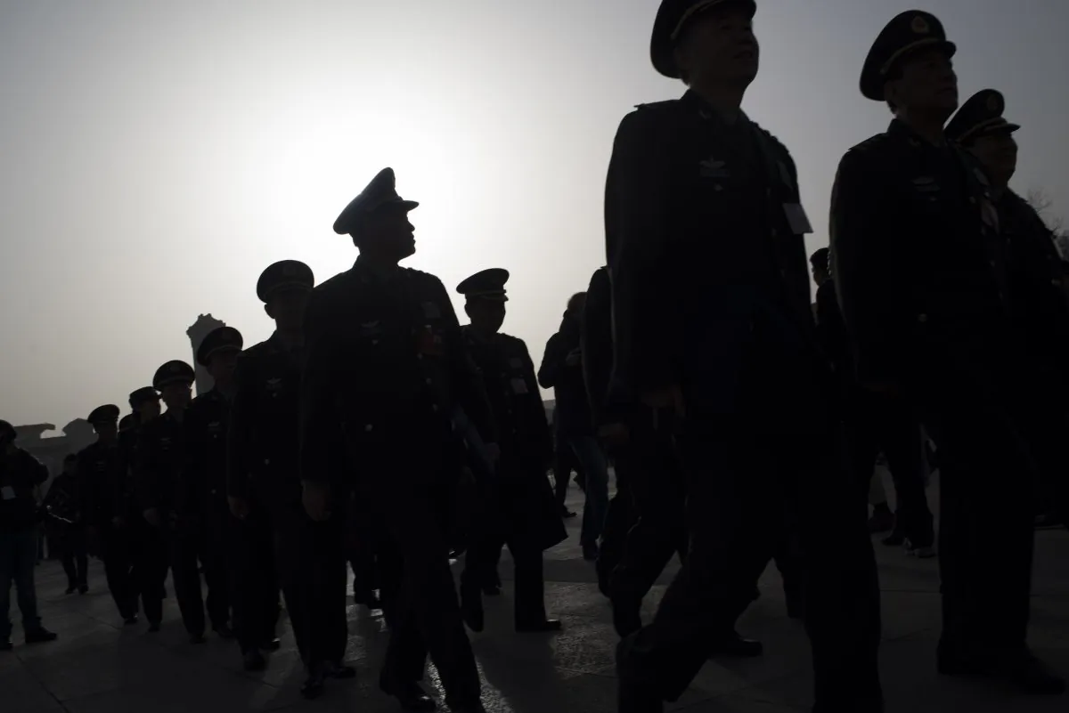 Military delegates arrive at the Great Hall of the People during the opening ceremony of the National People's Congress in Beijing on March 5, 2016. (Fred Dufour/AFP/Getty Images). 