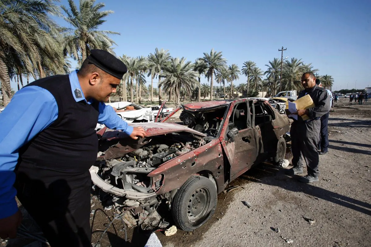 Iraqi emergency responders inspect debris at the site of a truck bomb, that exploded at a crowded checkpoint, in the Iraqi city of Hilla, south of Baghdad on March 6, 2016. The Islamic State jihadist group claimed responsibility for a suicide truck bomb blast that killed at least 47 people in the city of Hilla. (Haidar Hamdani/AFP/Getty Images)