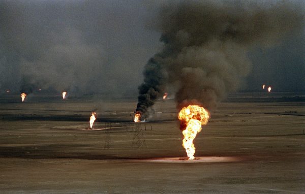 Burning oil wells damaged by retreating Iraqi soldiers in Al-Ahmadi oil field in southern Kuwait on March 14, 1991. (Nicholas Kamm/AFP/Getty Images)