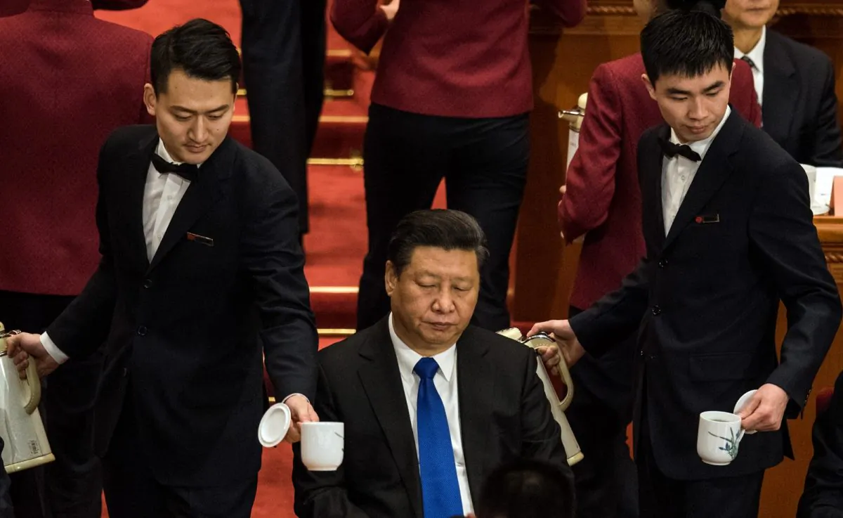 Chinese President Xi Jinping (C) attends  the opening session of the Fourth Session of the 12th National Committee of the Chinese People's Political Consultative Conference (CPPCC) at the Great Hall of the People in Beijing on March 3, 2016.(JOHANNES EISELE/AFP/Getty Images)