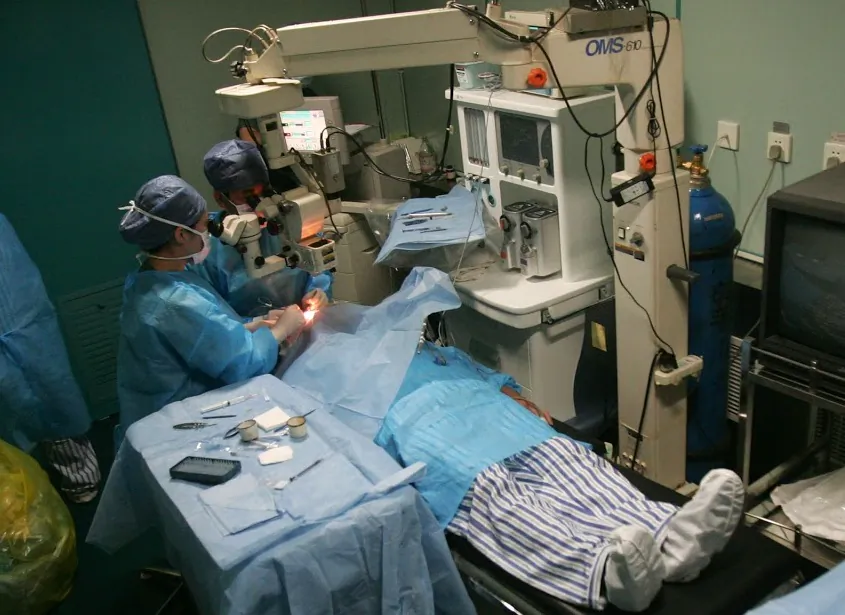 Doctors carry out a free cataract removal surgery for a patient on the Lifeline Express May 11, 2008 in Nanyang of Henan Province, China. (China Photos/Getty Images)