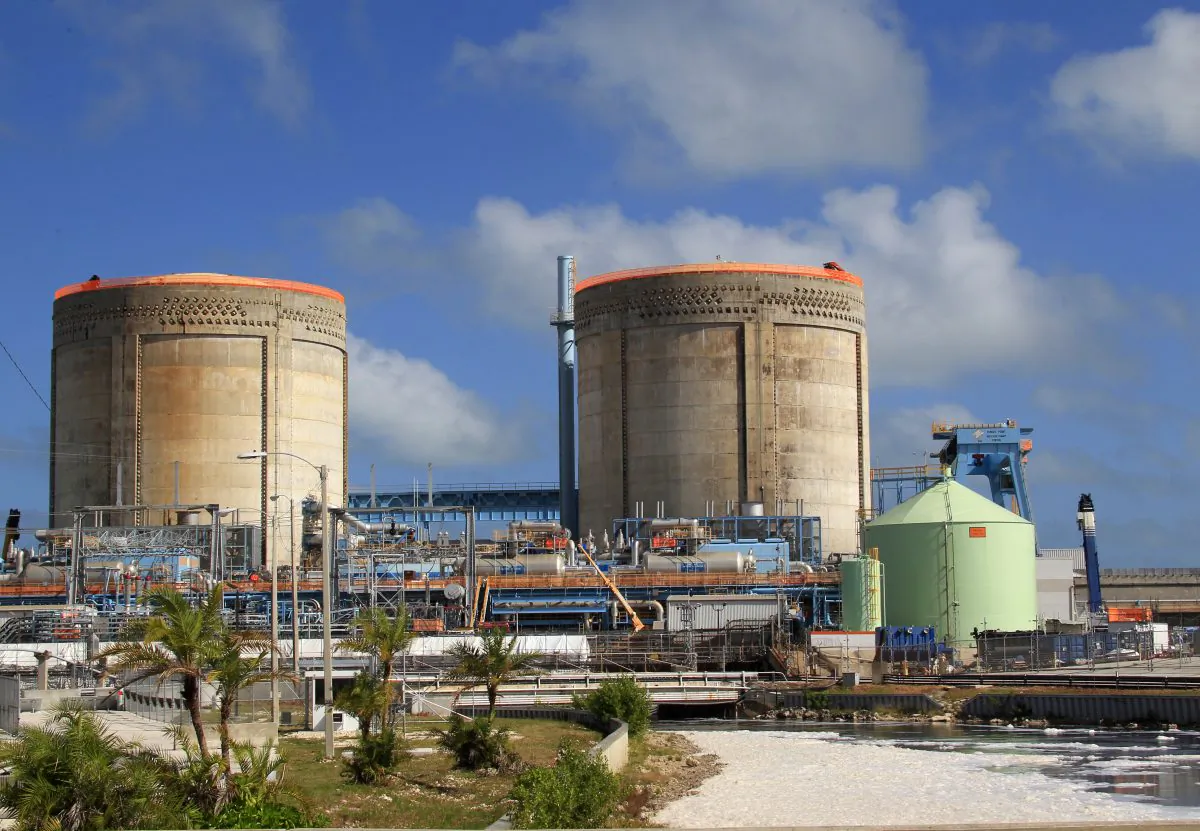 A cooling canal, foreground right, and the two nuclear reactor containment buildings at the Turkey Point Nuclear Power Plant are shown, Wednesday, Nov. 16, 2011 in Homestead, Fla. (AP Photo/Wilfredo Lee)