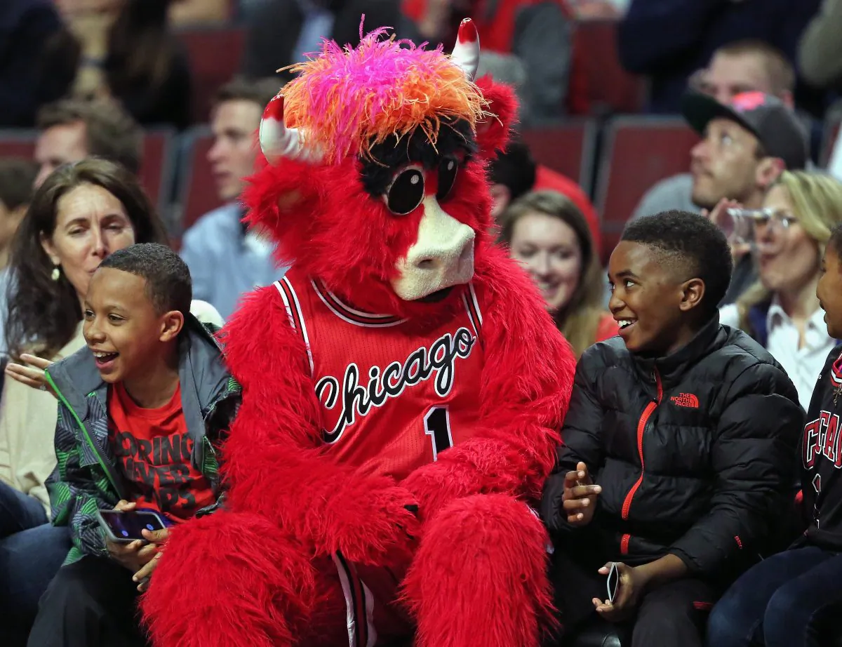 Benny, the mascot of the Chicago Bulls, entertains young fans siting courtside as the Bulls take on the Milwaukee Bucks at the United Center on March 7. (Jonathan Daniel/Getty Images)