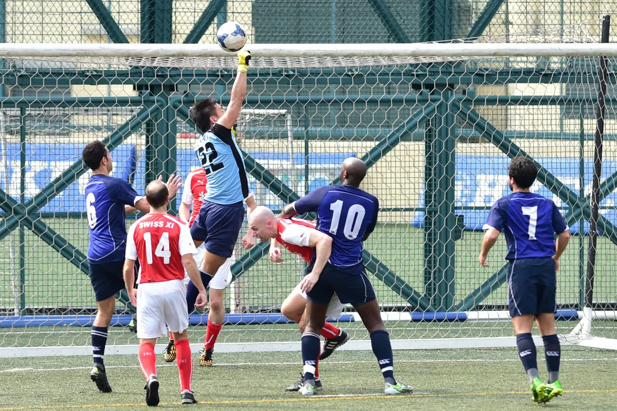 Swiss XI goalkeeper Yohei Zama punches clear during a Wanderers attack during the Yau Yee Division 1 match at Sports Road on Sunday March 6. Wanderers won the match 2-nil with both goals scored in the second half. (Bill Cox/Epoch Times)