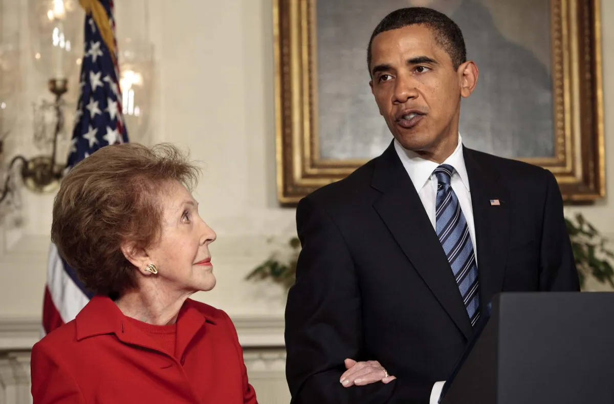 Former first lady Nancy Reagan listens to President Barack Obama speak during a bill signing in the Diplomatic Reception Room of the White House June 2, 2009 in Washington, DC.  (Photo by Brendan Smialowski/Getty Images)