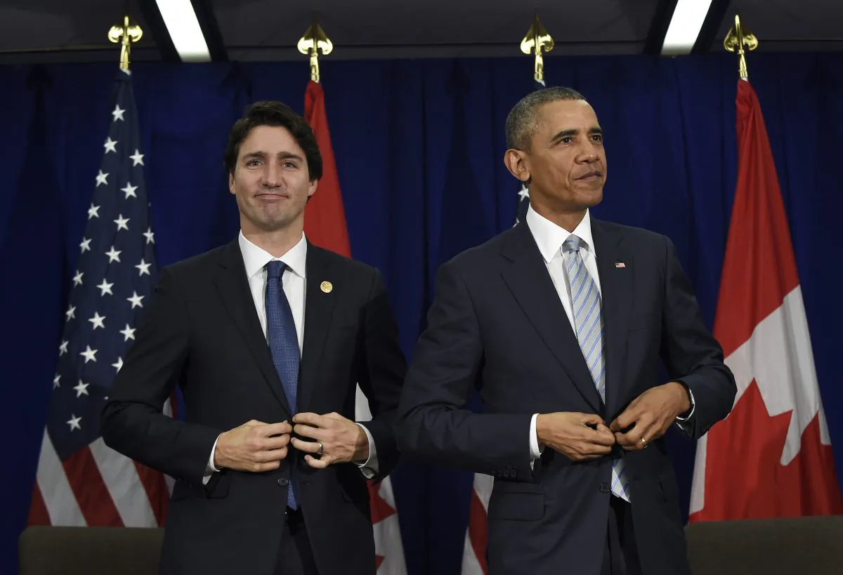 U.S. President Barack Obama, right, and Canadas Prime Minister Justin Trudeau stand up following their bilateral meeting at the Asia-Pacific Economic Cooperation summit in Manila, Philippines, Thursday, Nov. 19, 2015. (AP Photo/Susan Walsh)