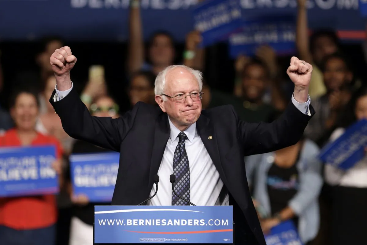 Democratic presidential candidate Sen. Bernie Sanders (I-Vt.) acknowledges his supporters on arrival at a campaign rally in Miami on March 8, 2016. (AP Photo/Alan Diaz)