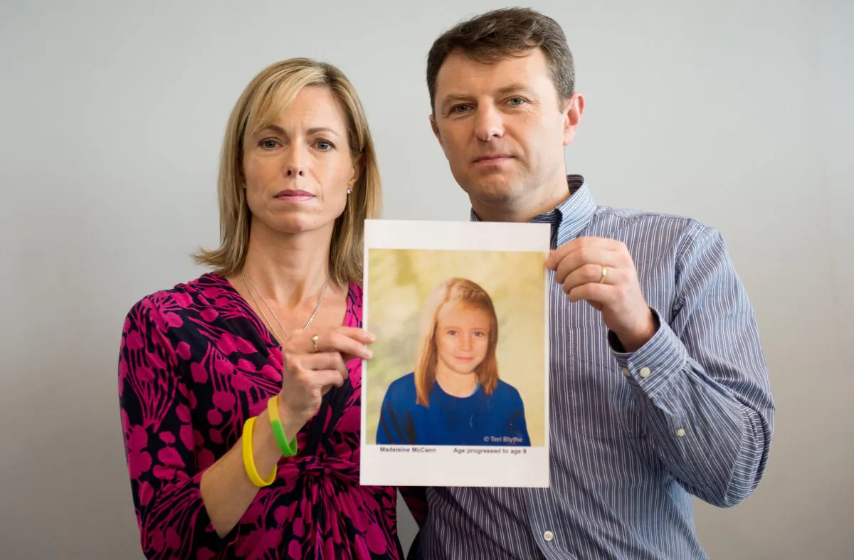 Parents of missing girl Madeleine McCann, Kate (L) and Gerry McCann (R) pose with an artist's impression of how their daughter might look now at the age of nine ahead of a press conference in central London on May 2, 2012, five years after Madeleine's disappearance while on a family holiday in Portugal. (Leon Neal/AFP/GettyImages)