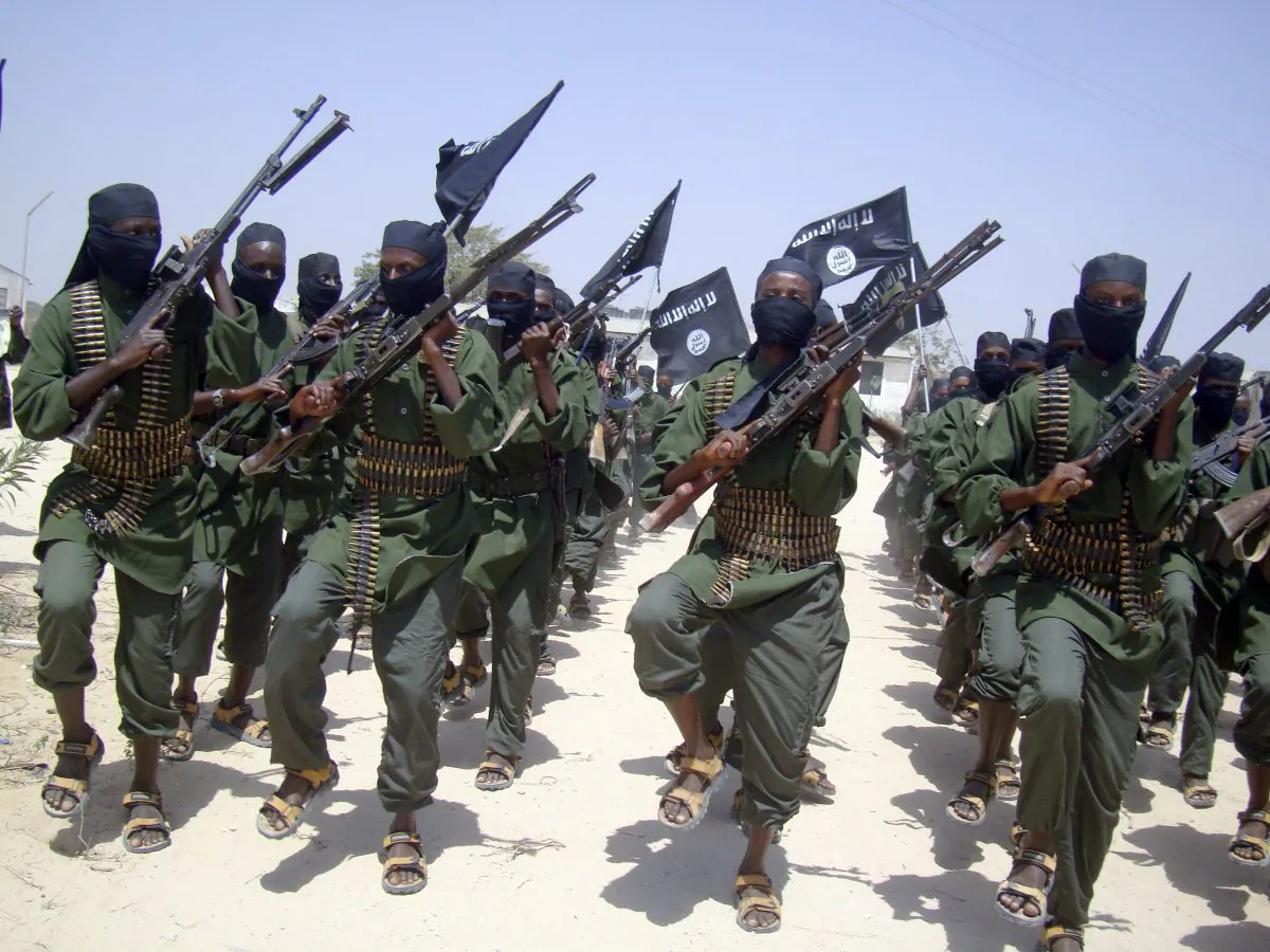 Al-Shabaab terroritsts march with their weapons during military exercises on the outskirts of Mogadishu, Somalia, on Feb. 17, 2011. (AP Photo/Mohamed Sheikh Nor)