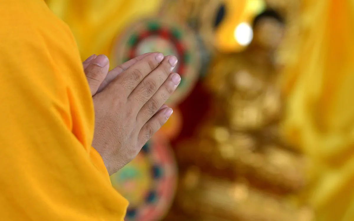 A Buddhist monk prays. (Jay Directo/AFP/Getty Images)