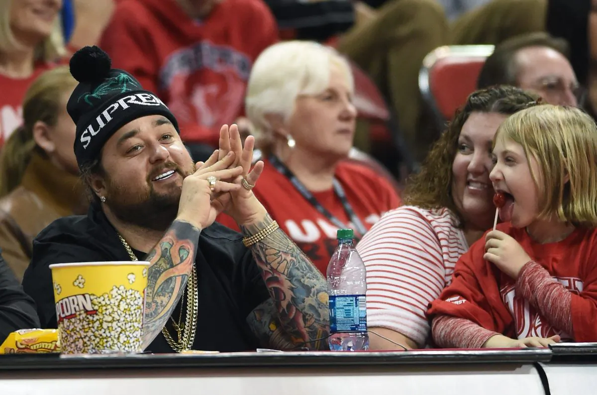 Austin "Chumlee" Russell (L) from History's "Pawn Stars" television series watches a game between the Portland Pilots and the UNLV Rebels at the Thomas & Mack Center on December 17, 2014 in Las Vegas, Nevada. UNLV won 75-73 in overtime.  (Photo by Ethan Miller/Getty Images)