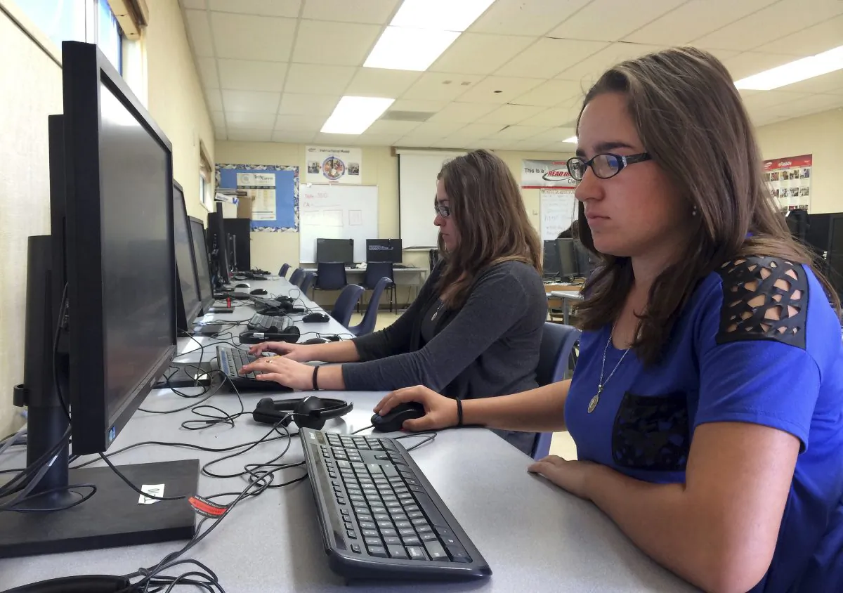 Sylvia Fonseca works on a computer at Cuyama Valley High School New Cuyama, Calif., on April 30, 2015. (AP Photo/Christine Armario, File)