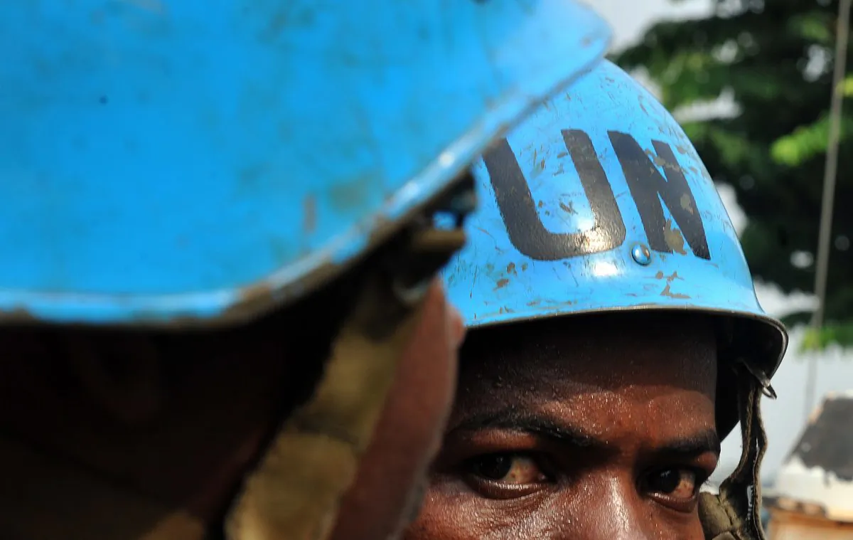 A U.N. peacekeeper looks on as he patrols in a street in Abidjan, Ivory Coast, on Jan. 8, 2011. (Issouf Sanogo/AFP/Getty Images)