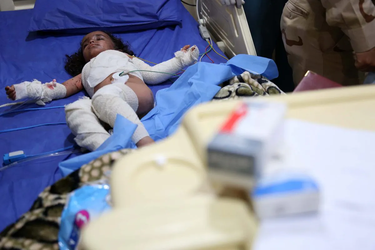 An Iraqi girl is treated at the general hospital in the northern Iraqi city of Kirkuk on March 10, 2016, after she was injured in a rocket attack in the nearby town of Taza. Seventeen residents of Taza were being treated following a rocket attack launched on March 9, 2016, from Bashir, south of the city of Kirkuk, medical sources said. Hundreds of protesters blocked Iraq's main highway on March 10, 2016, to demand strikes against Bashir from which the Islamic State (ISIS) launched a chemical attack. (Mohammed Sawaf/AFP/Getty Images)