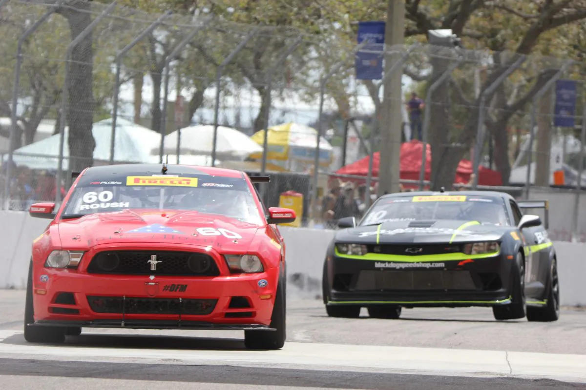 Jack Roush Jr. in the #60 Roush Mustang leads Lawson Aschenbach, in the #10 Black Dog Speed Shop Camaro Z28 early in the Pirelli World Challenge GTS race. (Chris Jasurek/Epoch Times)