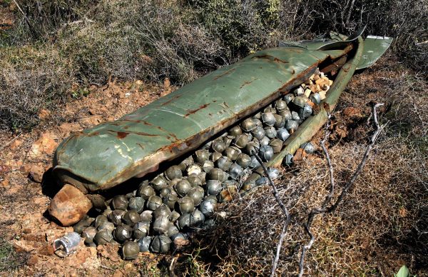 A Cluster Bomb Unit containing more than 600 cluster bombs, that was dropped by Israeli warplanes during the 34-day-long Hezbollah-Israeli war, sits in a field in the southern village of Ouazaiyeh, Lebanon, on Nov. 9, 2006. (AP Photo/Mohammed Zaatari)