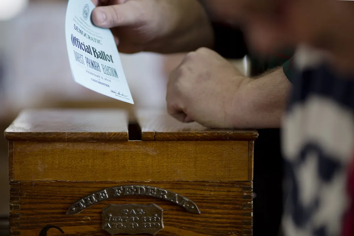 A voter casts his ballot in Chichester, N.H., on Feb. 9, 2016. (Dominick Reuter/AFP/Getty Images)