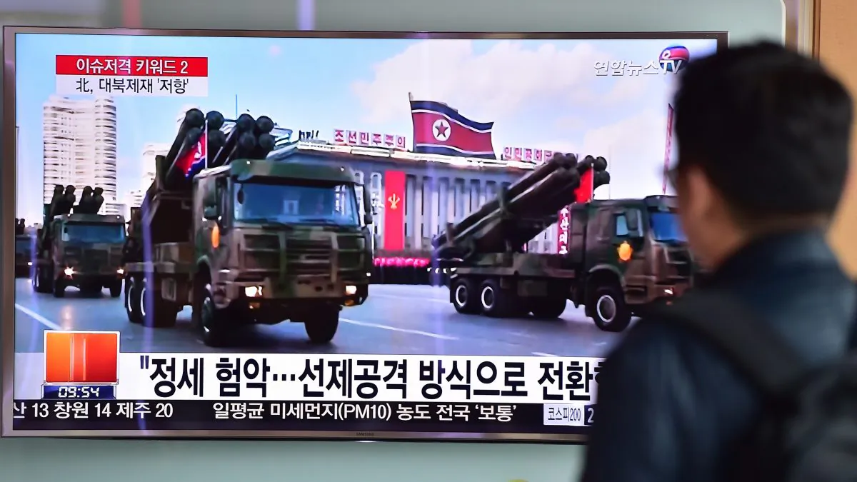 A man watches a news report showing file footage of North Korean missiles on parade, at a railway station in Seoul on March 4, 2016. (Jung Yeon-je/AFP/Getty Images)