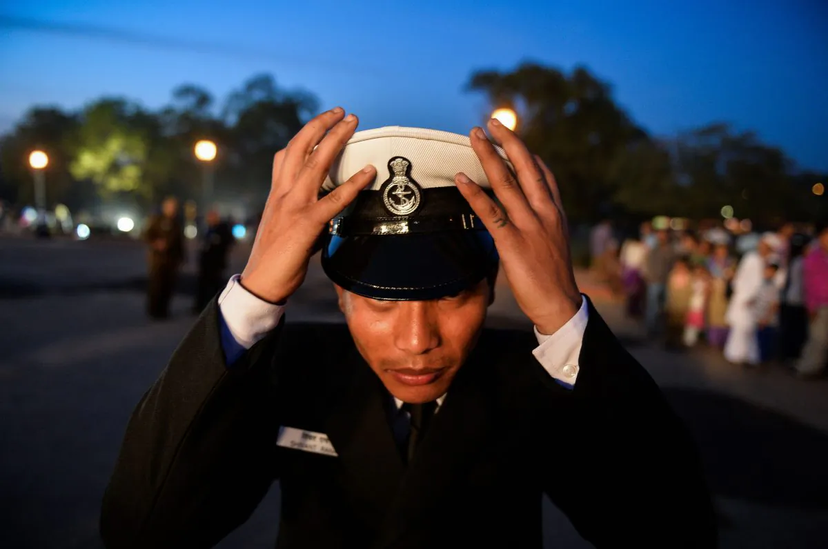 A member of the Indian Navy band adjusts his cap in New Delhi on March 4. Japan and Vietnam are asking India to help counter Chinese aggression in the South China Sea. (Chandan Khanna/AFP/Getty Images)