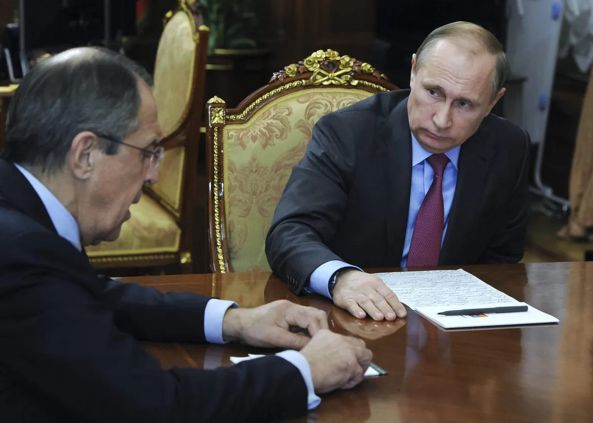 Russian President Vladimir Putin, right, listens to Russian Foreign Minister Sergey Lavrov during their meeting in the Kremlin in Moscow, Russia, on March 14, 2016. (Mikhail Klimentyev/Sputnik, Kremlin Pool Photo via AP)