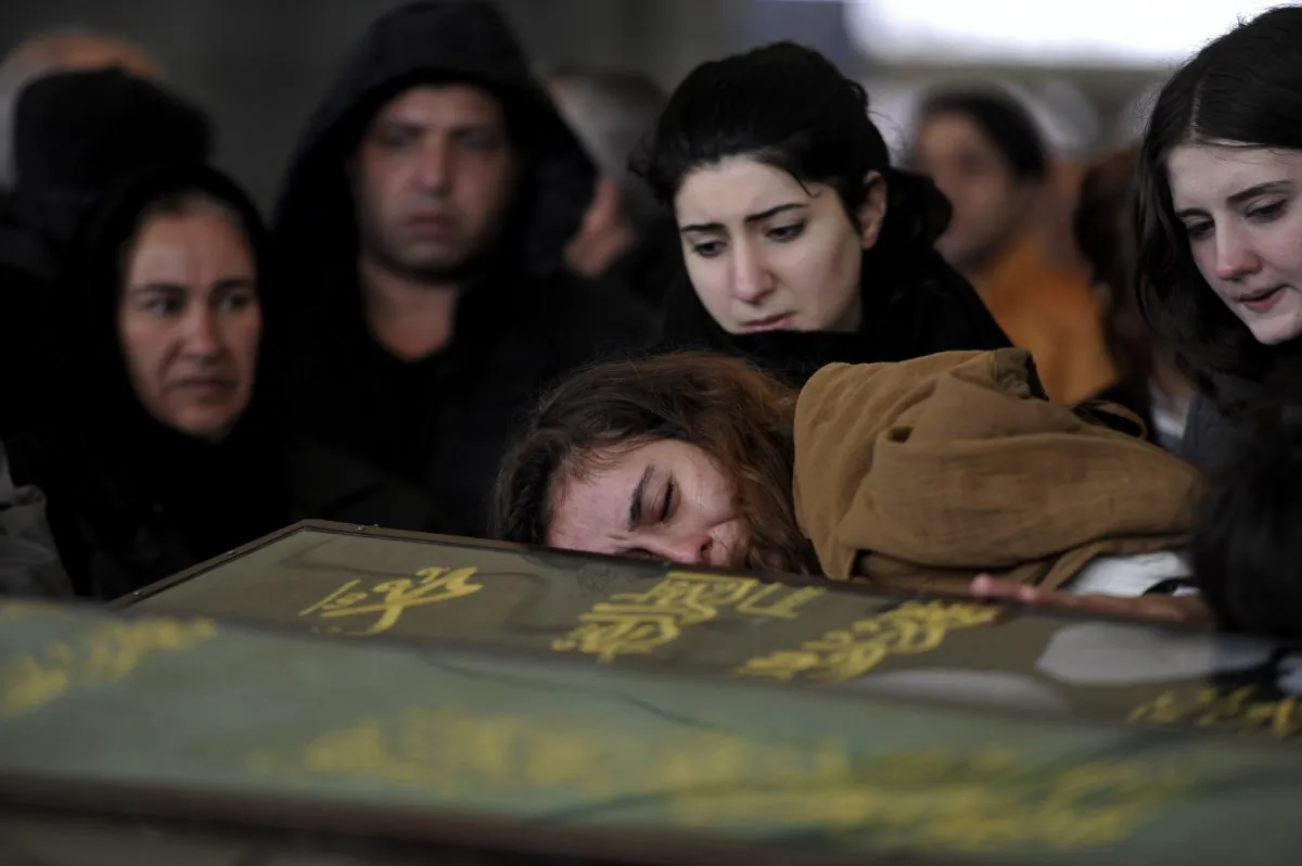 Members of Cermik family attend the funeral processions for three members of their family killed in Sunday's explosion in Ankara, Turkey, Monday, March 14, 2016. A senior government official told The Associated Press that authorities believe the attack was carried out by two bombers, one of them a woman, and was the work of Kurdish militants. It was the second deadly attack blamed on Kurdish militants in the capital in the past month. (AP Photo)