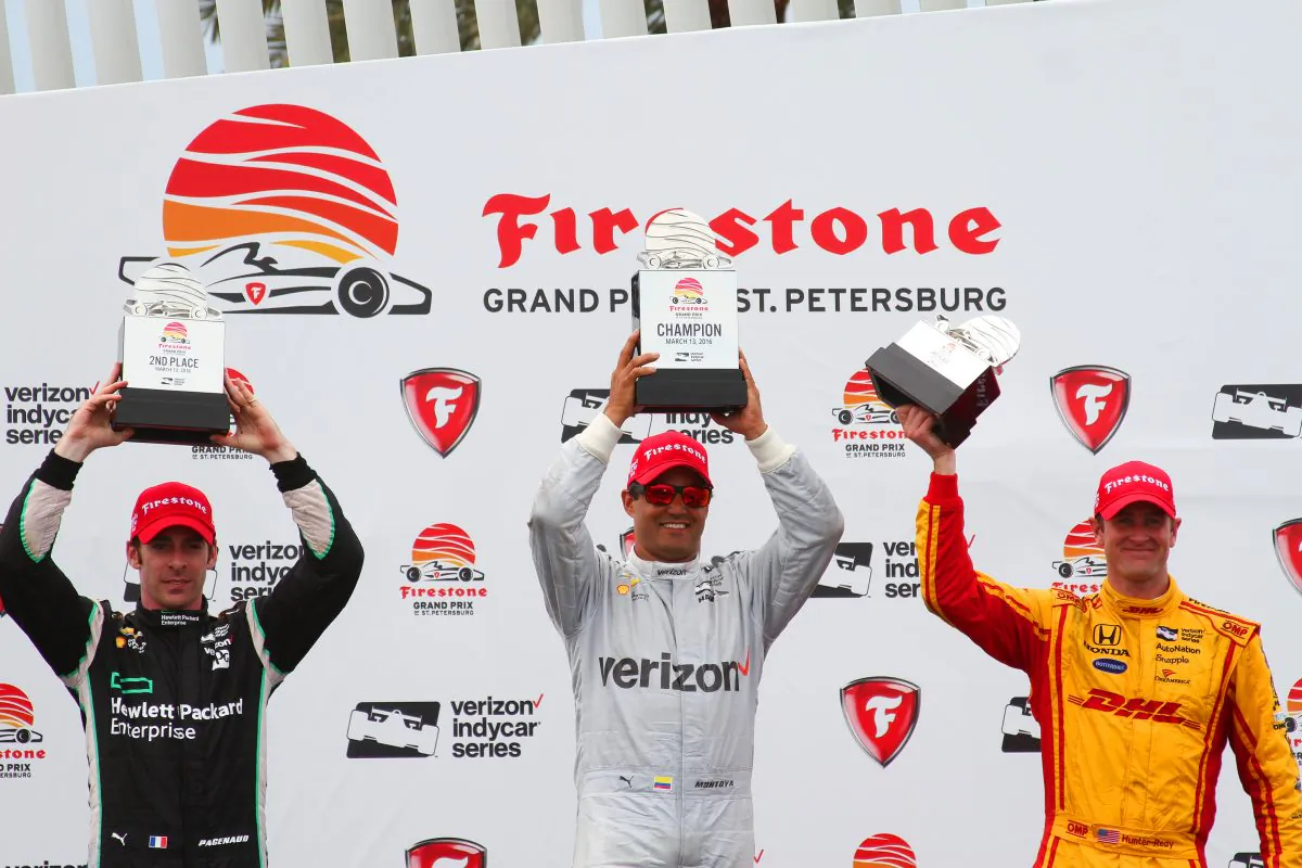 (L-R) Simon Pagenaud, Juan Montoya, and Ryan Hunter-Reay raise their trophies after the Verizon IndyCar Grand Prix of St. Petersburg, Sunday, March 13, 2016. (Chris Jasurek/Epoch Times)