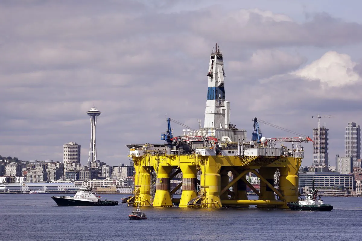 In this May 14, 2015, file photo, the oil drilling rig Polar Pioneer is towed toward a dock in Elliott Bay in Seattle. (AP Photo/Elaine Thompson, File)