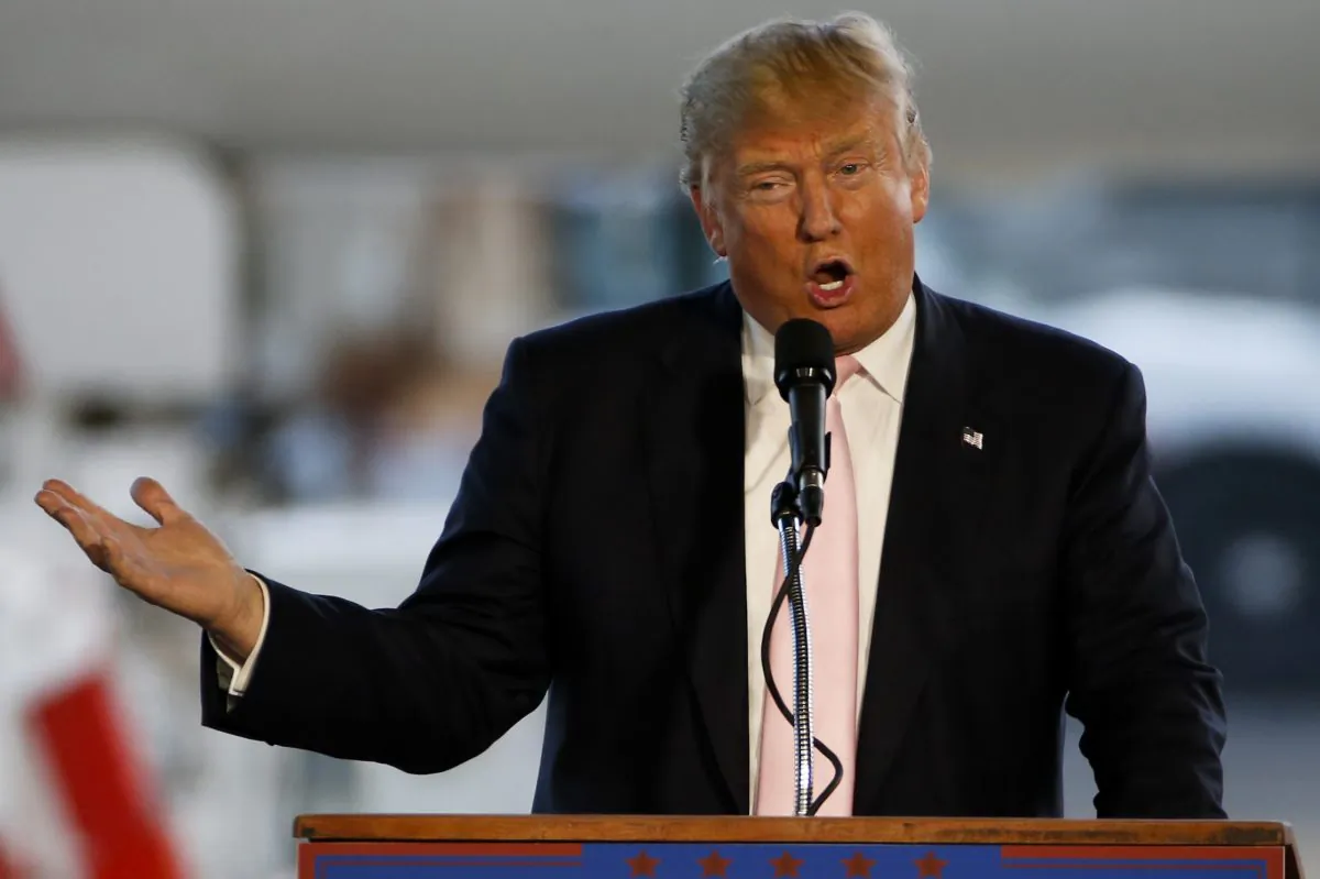 In this Monday, March 14, 2016 file photo, Republican presidential candidate, Donald Trump holds a plane-side rally in a hanger at Youngstown-Warren Regional Airport in Vienna, Ohio. (AP Photo/Gene J. Puskar, File)