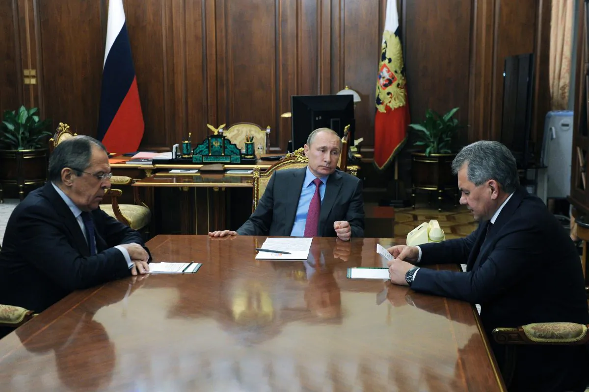 Russian President Vladimir Putin (C) meets with Defence Minister Sergei Shoigu (R) and Foreign Minister Sergei Lavrov (L) at the Kremlin in Moscow on March 14, 2016. (Mikhail Klimentyev/Sputnik via Getty Images)